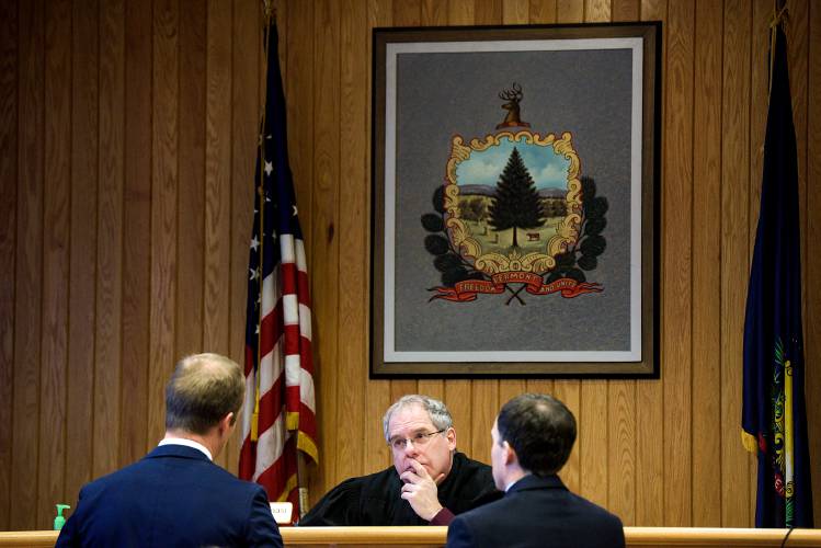 Attorney Cabot Teachout, left, speaks with Windsor County State's Attorney David Cahill, right, and Judge Timothy Tomasi